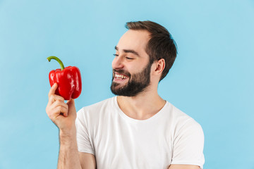 Handsome young bearded man wearing t-shirt standing