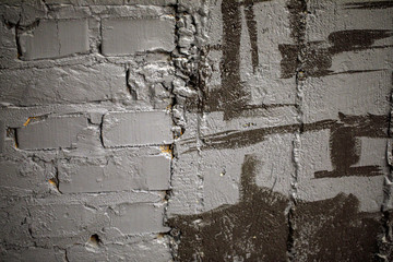 High resolution aged grey brick wall with concrete for text, logo or other design.
