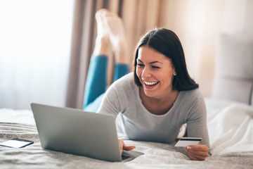 Girl using her credit card for online shopping.