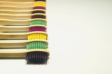 Eco toothbrushes on green background