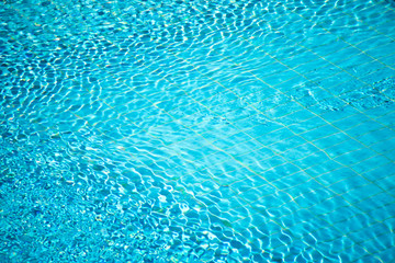 Fototapeta na wymiar A surface of water in swimming pool. Aqua background