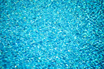 A surface of water in swimming pool. Aqua background