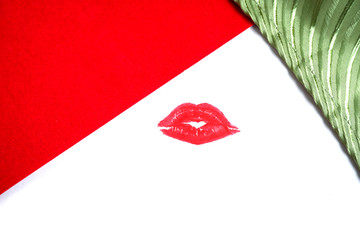 Designer advertising background. Lips on colored cardboard. Cosmetics.