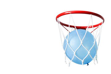 Blue balloon in a basketball net. Accurate throw in the ring. 