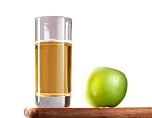 a glass of apple juice and an apple