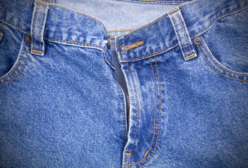 Fototapeta premium Zipper and pockets of jeans as fashion background