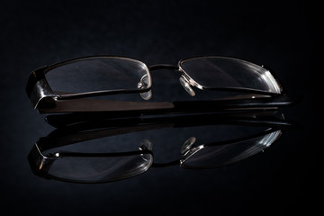 Glasses on a dark background.