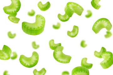 Falling celery slice isolated on white background, selective focus