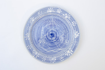 Blue ceramic plate with arabian cityscape - isolated on white background
