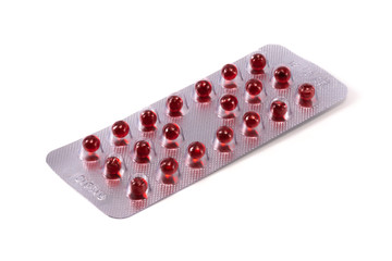 pills red balls in a blister