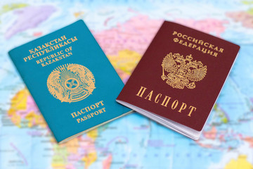 Passports of Russia and Kazakhstan on the background of the map - travel. Documents of neighboring states.