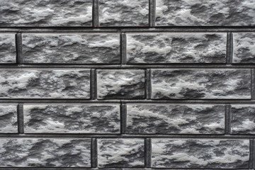 Surface of gray and black brick veneer wall
