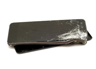 Smartphone with damaged screen isolated on white background