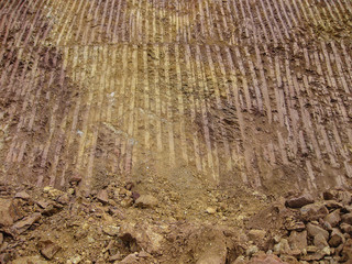  Mountain cutting by backhoe for road constructions in Laos.