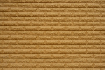 Front view of yellowish orange brick wall