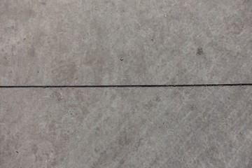 Fototapeta premium Horizontal joint between two grey concrete slabs
