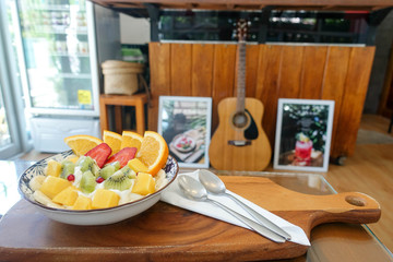 Fruit yogurt with mango orange kiwi strawberry banana
