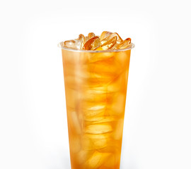 Red orange drink with ice cubes on white