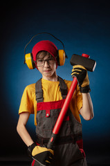the child the Builder costume posing with a work tool