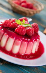 Delicious panna cotta dessert with raspberries sauce