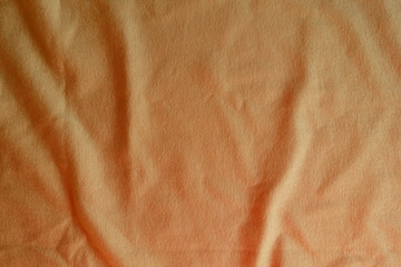 View of jammed beige cotton jersey fabric from above