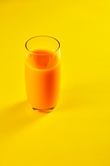 Mango juice drinks on a yellow background