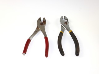 Obraz premium Old used pliers collection isolated on white background.