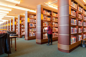 Ankara/Turkey - February 29 2020:  Rear view of student girl standing in Millet library in front of...