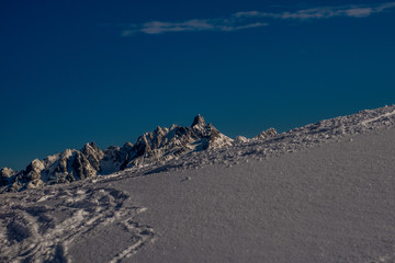 snowcapped mountain against blue sky