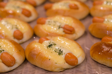 Sausage bread with mayo sauce on bakery tray. selective focus and shallow depth of field
