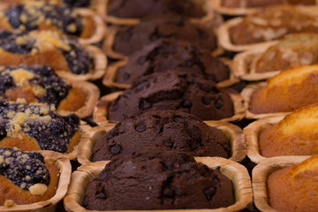 Chocolate muffin and nut muffin, homemade bakery.blueberry and chocolate muffins in paper cupcake...