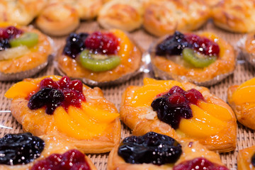 Honey Arabic Fruit Cake. Honey cake. Home made cake with beautiful fresh fruit decoration. Celebrating happy birthday.  selective focus and shallow depth of field