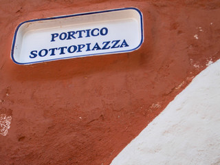 Porto Cervo port with typical Sardinian houses and yachts at the port