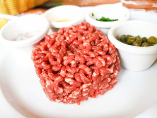 tasty Steak tartare (Raw beef) - classic steak tartare on white plate