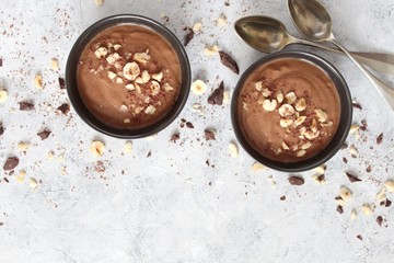 Chocolate smoothie with banana and nuts. Top view with copy space. Protein smoothie.