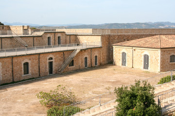 Fototapeta premium fortress located on the palau hills in sardinia with particular stairways and spectacular views over the city and the sea