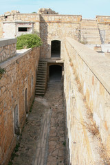 Fototapeta premium fortress located on the palau hills in sardinia with particular stairways and spectacular views over the city and the sea