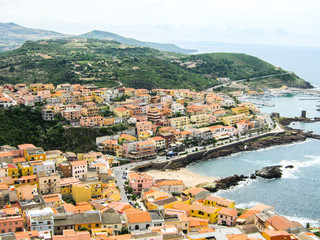 Fototapeta na wymiar Porto Cervo port with typical Sardinian houses and yachts at the port