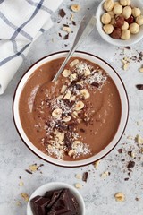 Chocolate smoothie with banana and nuts. Top view with copy space. Protein smoothie.