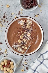 Chocolate smoothie with banana and nuts. Top view with copy space. Protein smoothie.