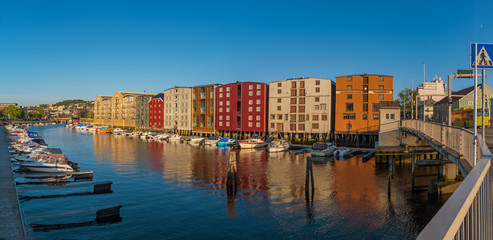 TRONDHEIM, NORWAY - july, 2019: Colorful old houses at the Nidelva river embankment in Trondheim, Norway.