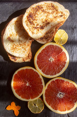 french croutons and red oranges on the fence