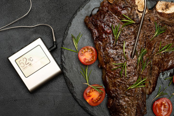 Cooked T-bone or Porterhouse  with a thermometer. Medium. 