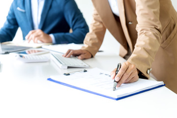 business man and woman sit at the table
