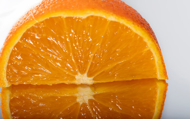 Closeup view on half orange on white background