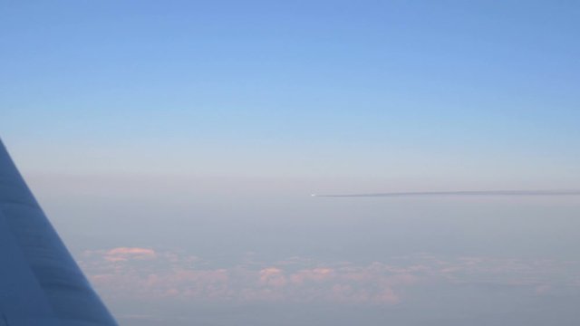 Airplane on the sky seeing from the other airplane in 4k slow motion 60fps