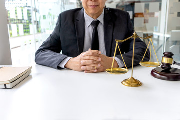In the office of Judge or lawyer, there are balance and gavel