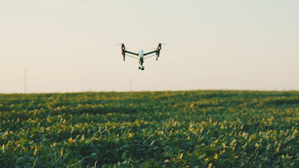Close up smart agriculture drone flying in sky rural aerial helicopter agros copter farm farming field industry landscape meadow nature plant professional vehicle harvest innovation slow motion