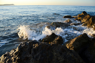Mediterranean sea waves and rock at summer.