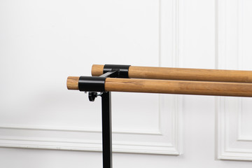 Ballet handrail in studio against white wall